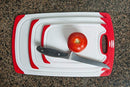 CC Boards 3-Piece Nonslip Cutting Board Set: Red and white plastic kitchen carving boards, each with juice groove and nonskid handle; dishwasher safe