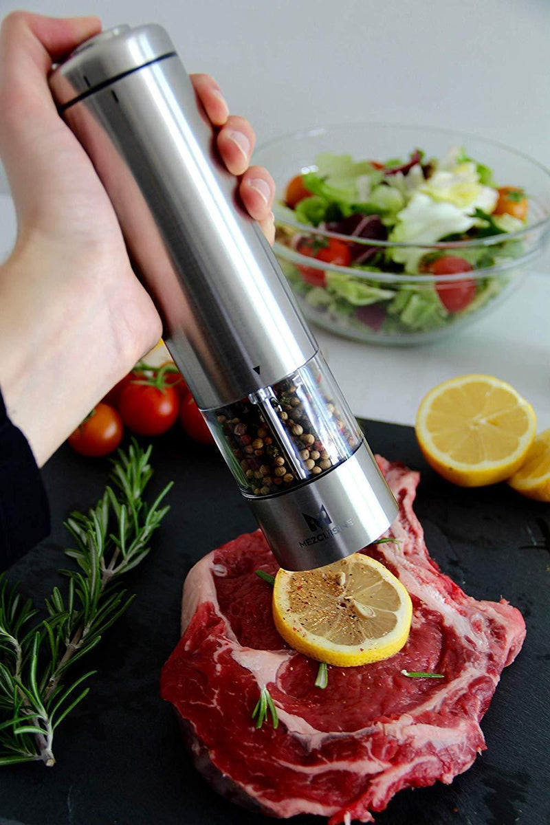 Electric Salt and Pepper Grinder Set by Mezcuisine – Premium Stainless Steel Salt&Pepper Mill Battery Operated with LED Light (Pack of 2) – Automatic Adjustable Shakers with Metal Stand