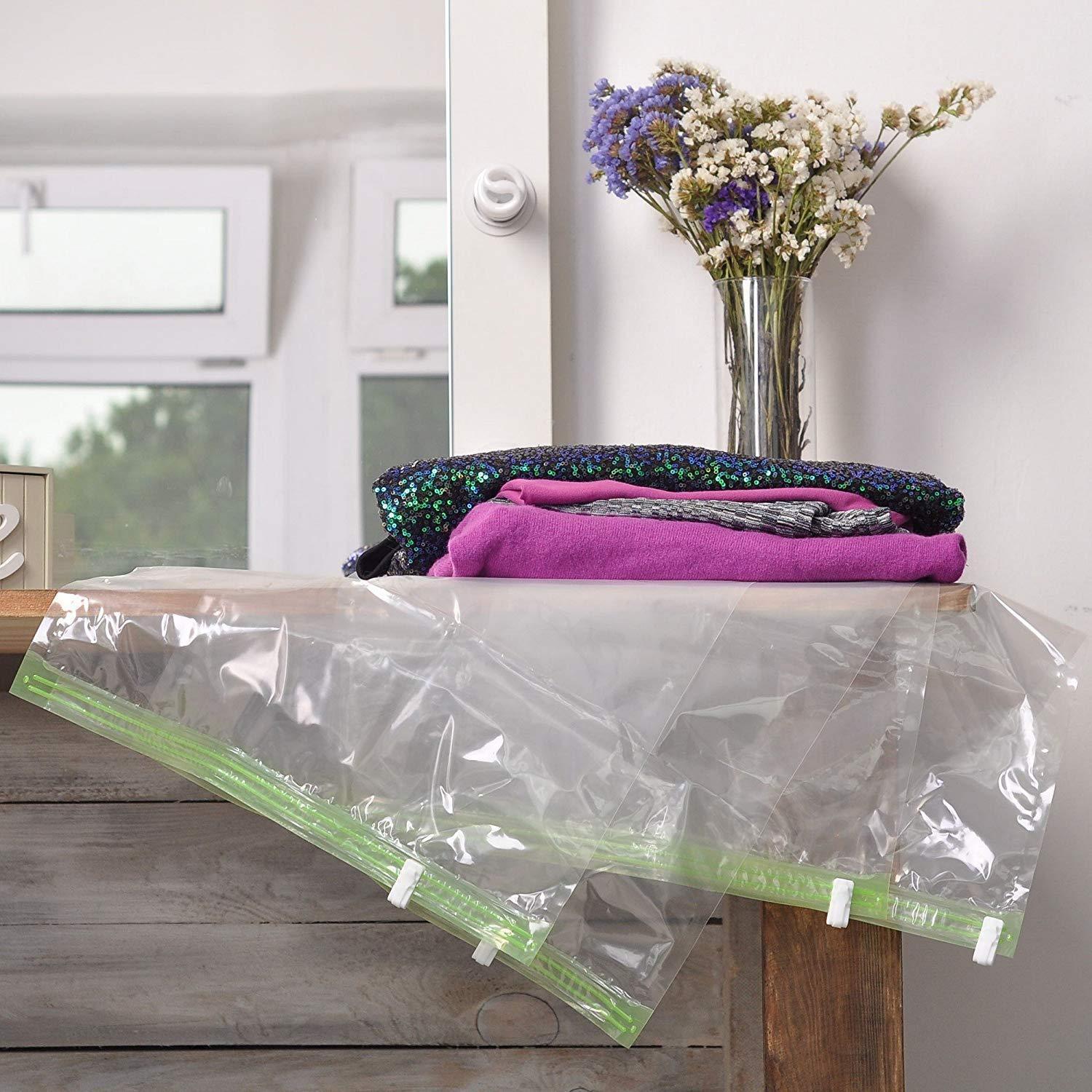 QYQBOON 8 Travel Space Saver Bags - No Vacuum or Pump Needed - for Clothes - Reusable - Luggage Compression - Set of 4 L and 4 M Sacks - Transparent